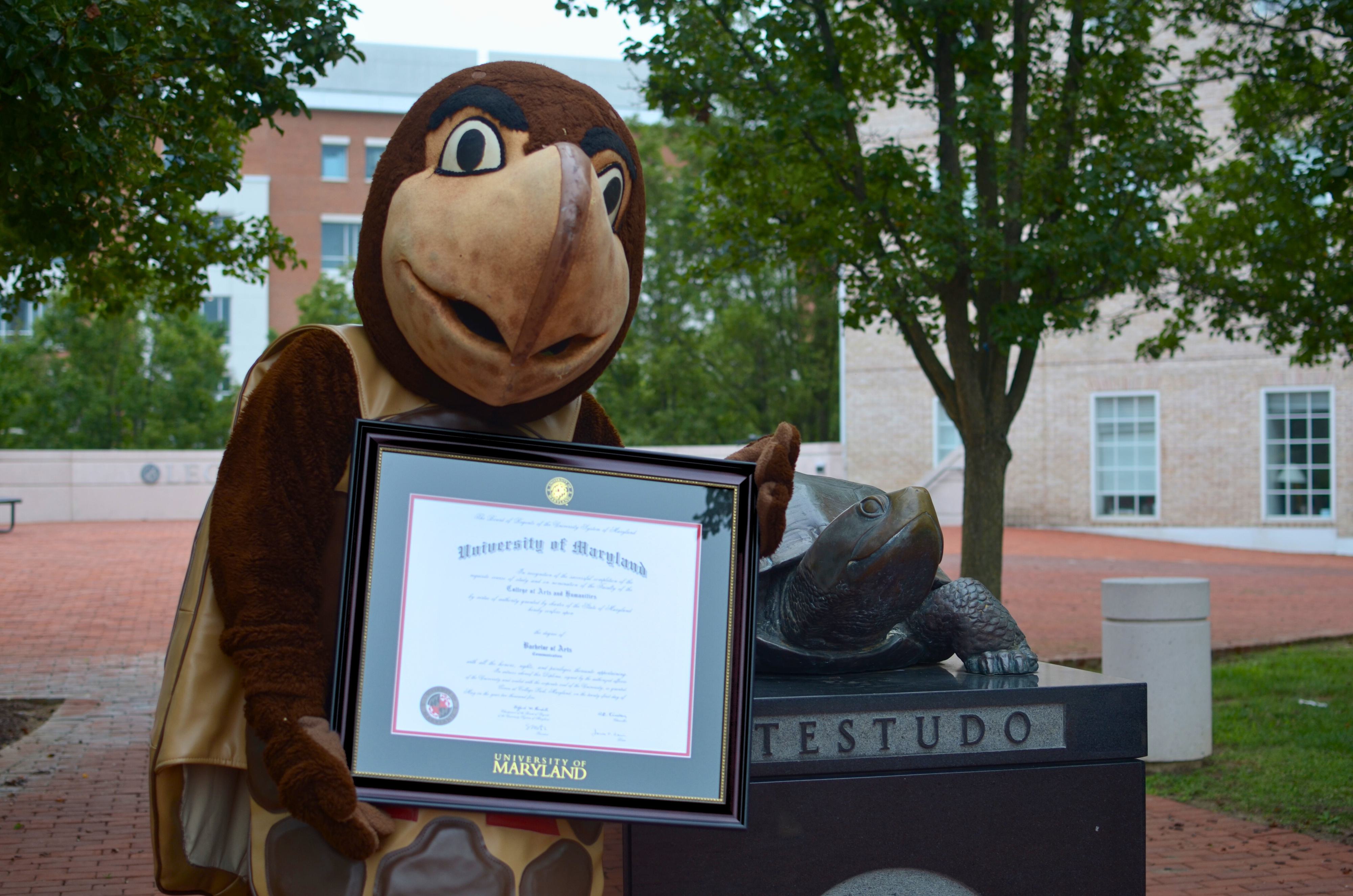 Testudo holding Herff Jones Diploma Frame