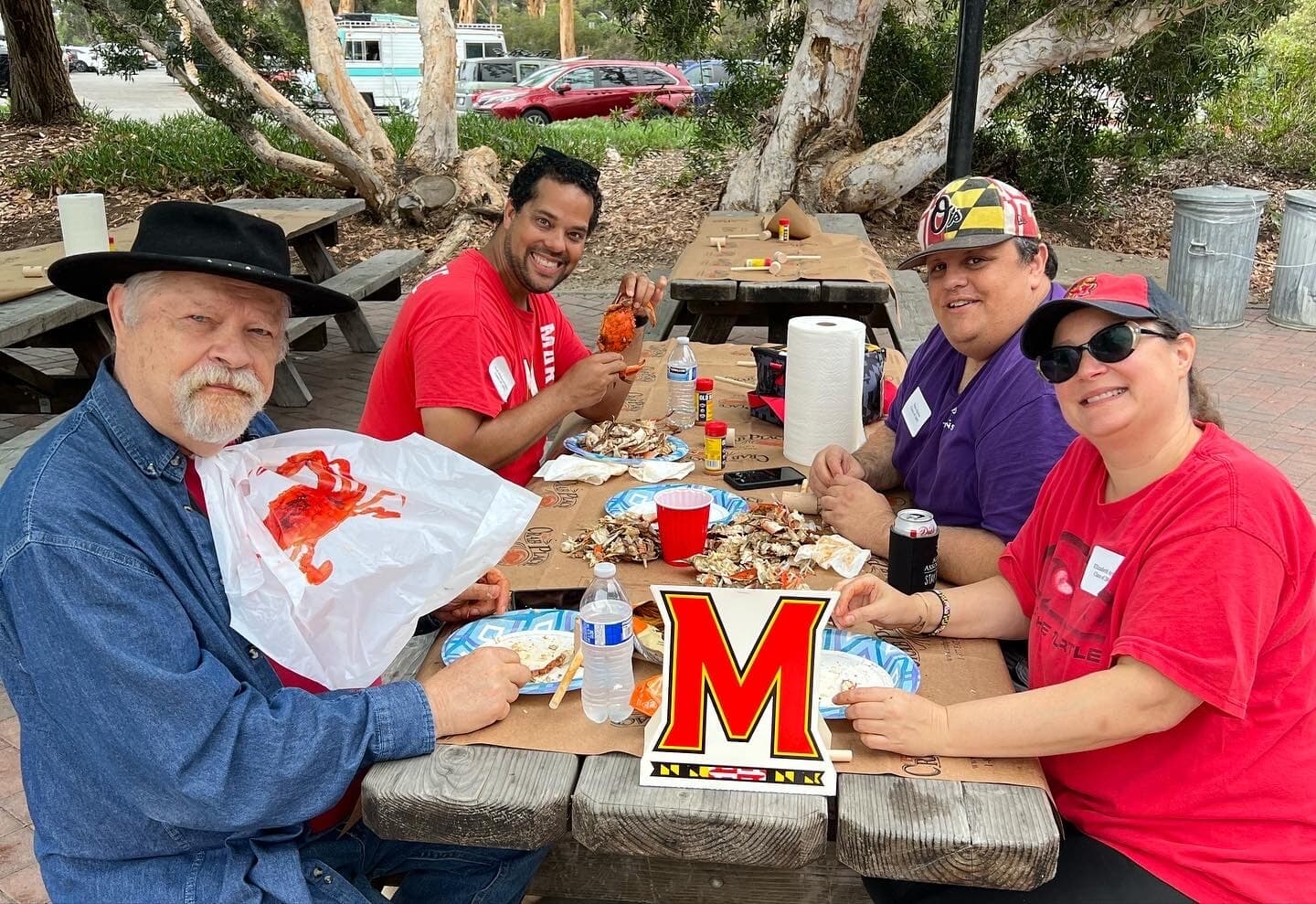 Terps enjoying crabs with friends and other alumni