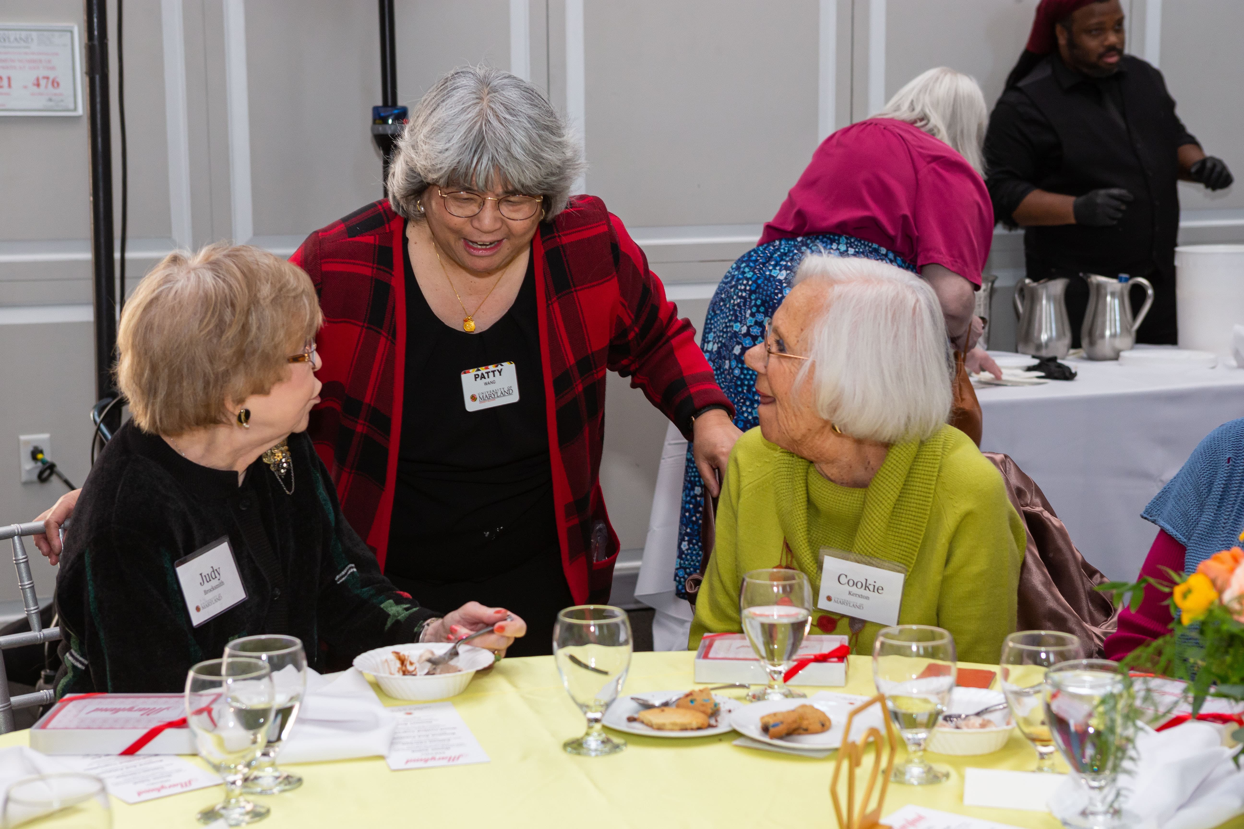 Patty Wang speaking with Founders Legacy Society donors at a recent luncheon.