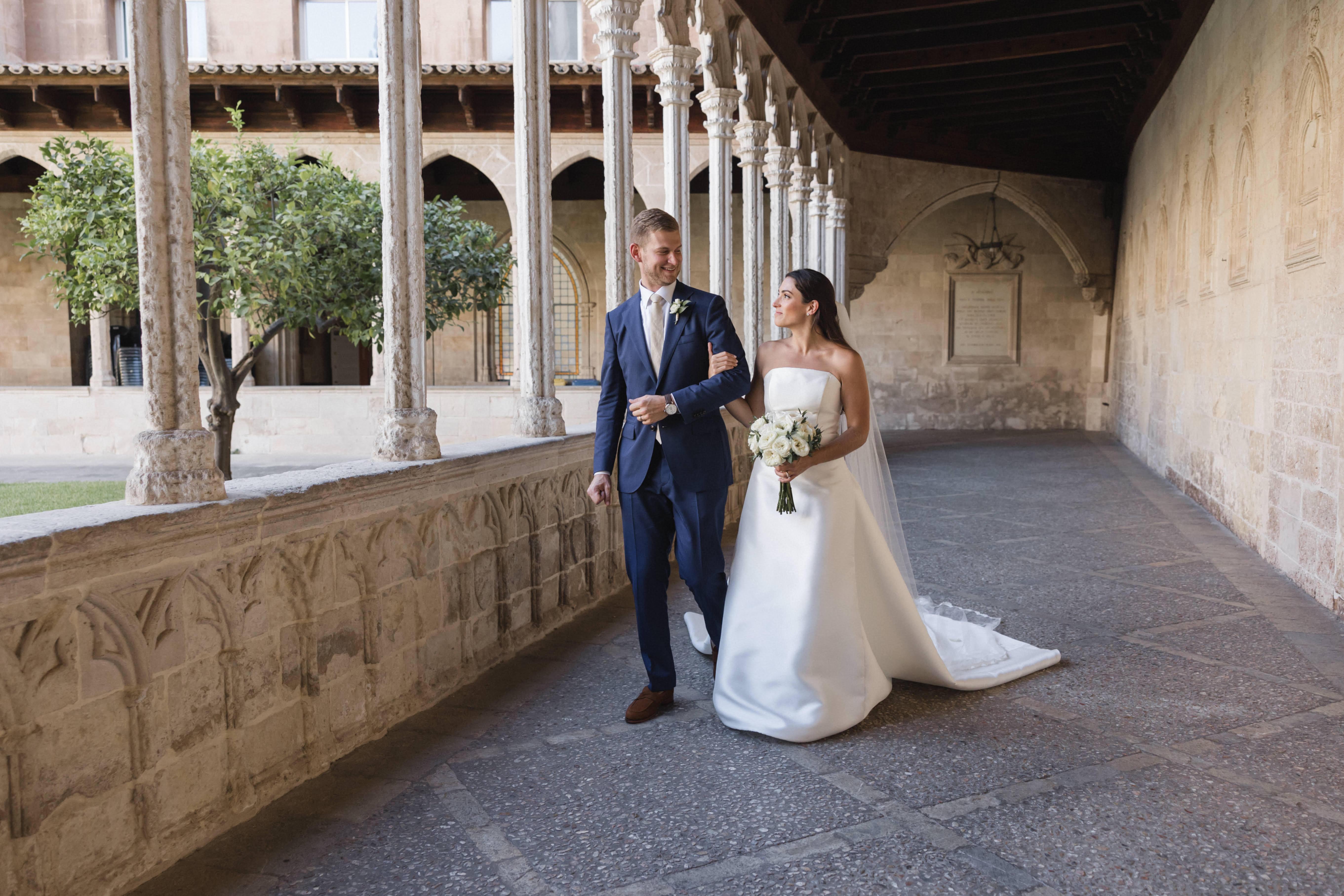 Ryan Aceto and Cristina Meneses taking a picture together at their wedding in Malorca, Spain