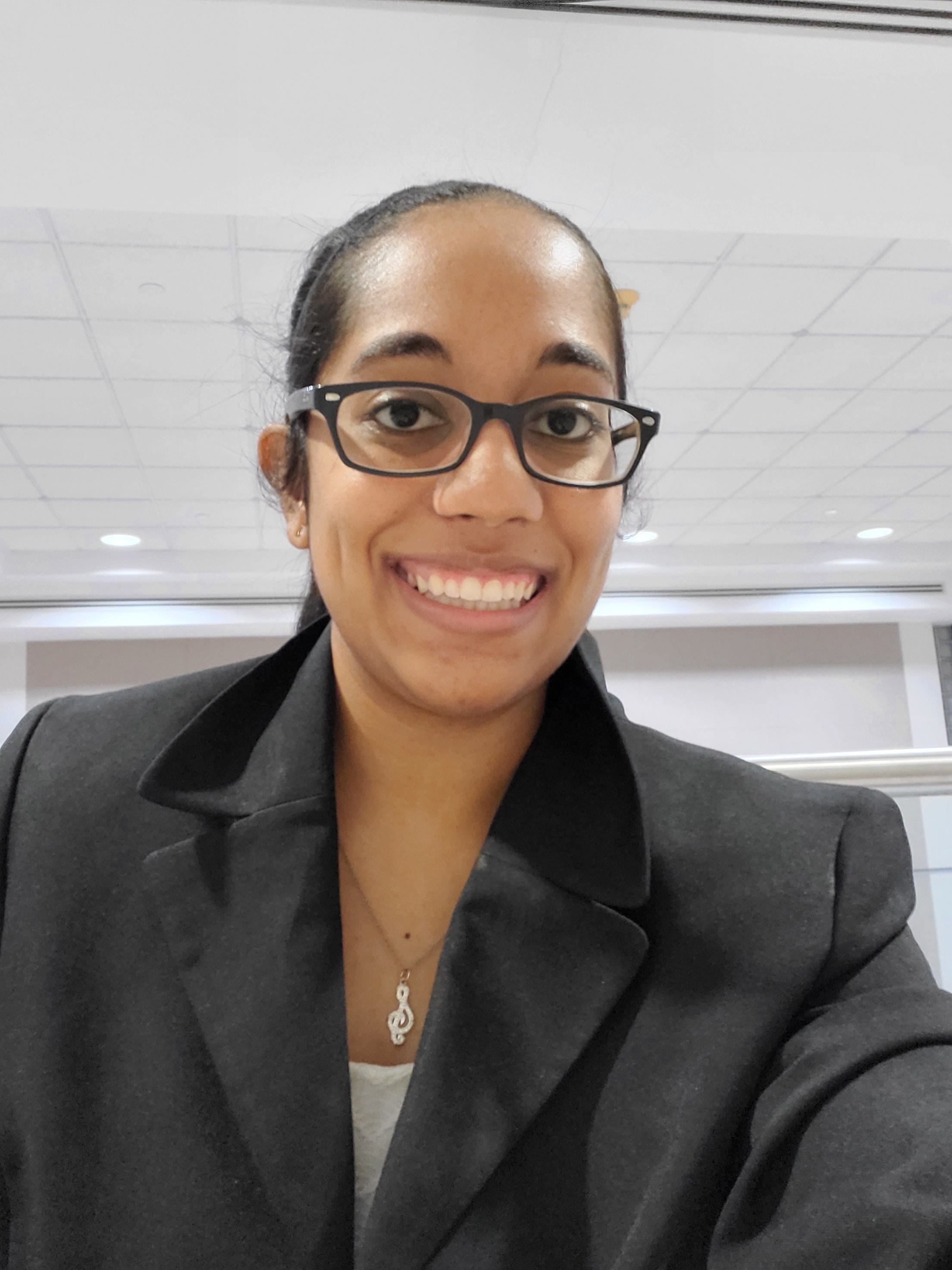 Melisa Bhavini Jangbahadur taking a selfie in professional attire