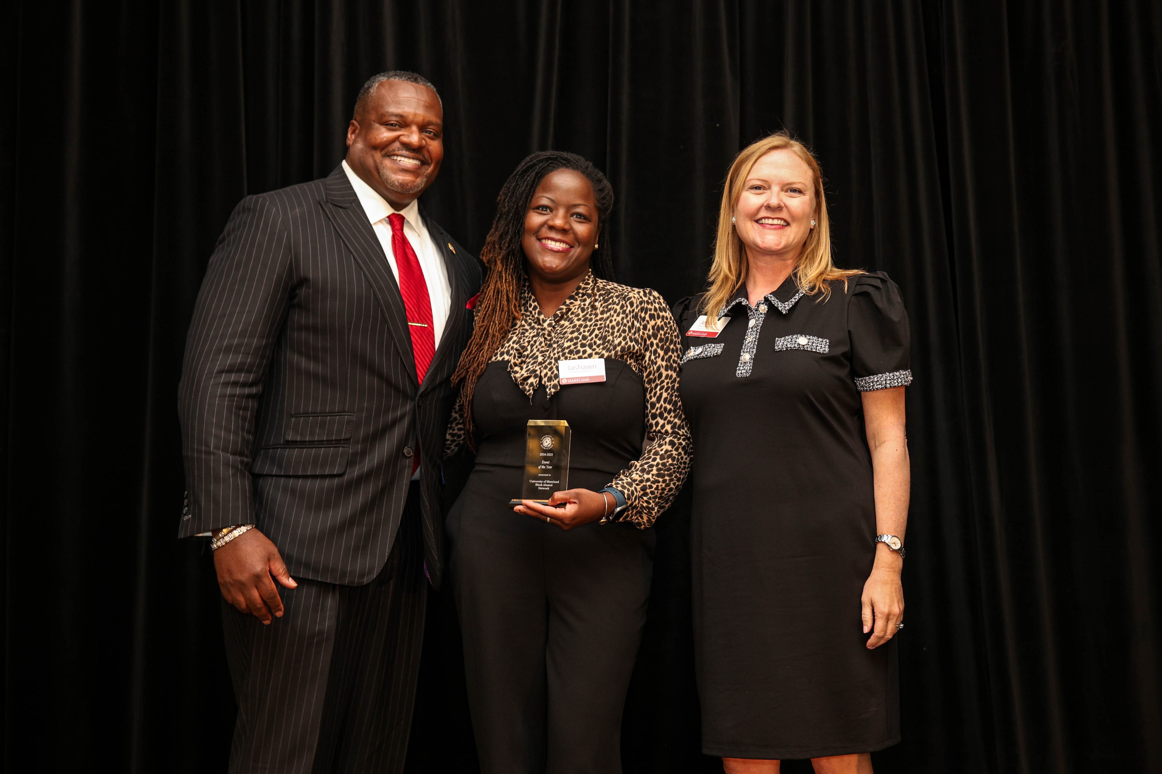 An UMBA network member poses with Bert Williams and Jessica Roberts