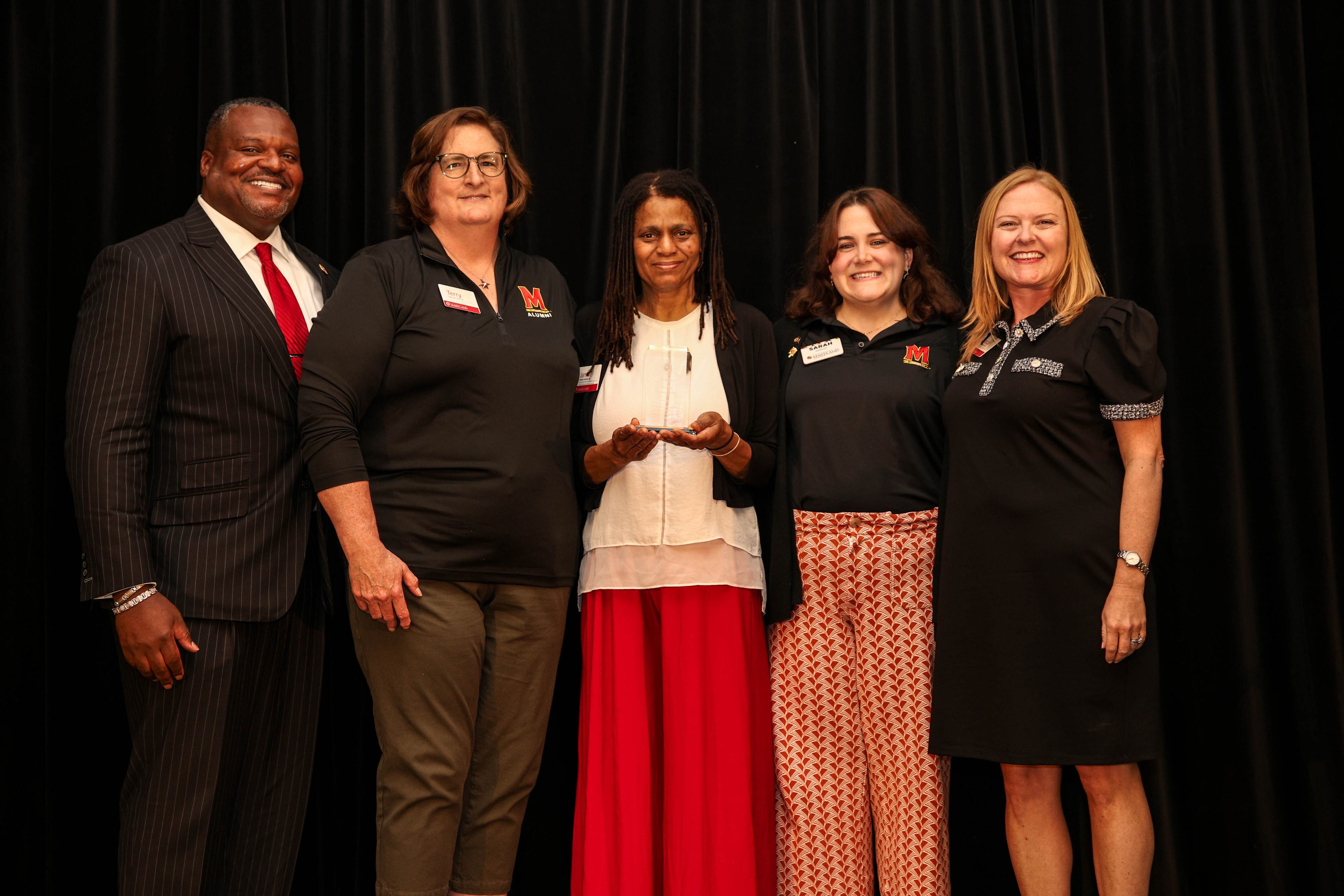 Members of the CMNS Alumni Network pose for a photo with Bert Williams and Jessica Roberts