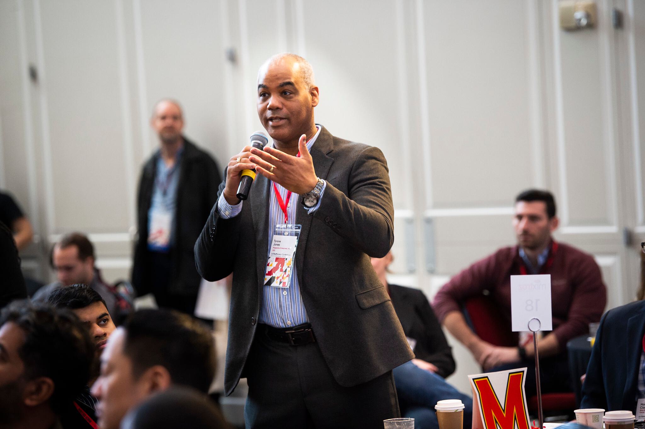 Man asking question at conference