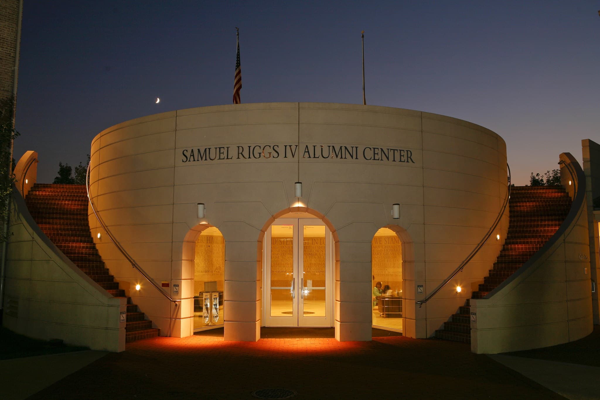 The Samuel Riggs IV Alumni Center at night