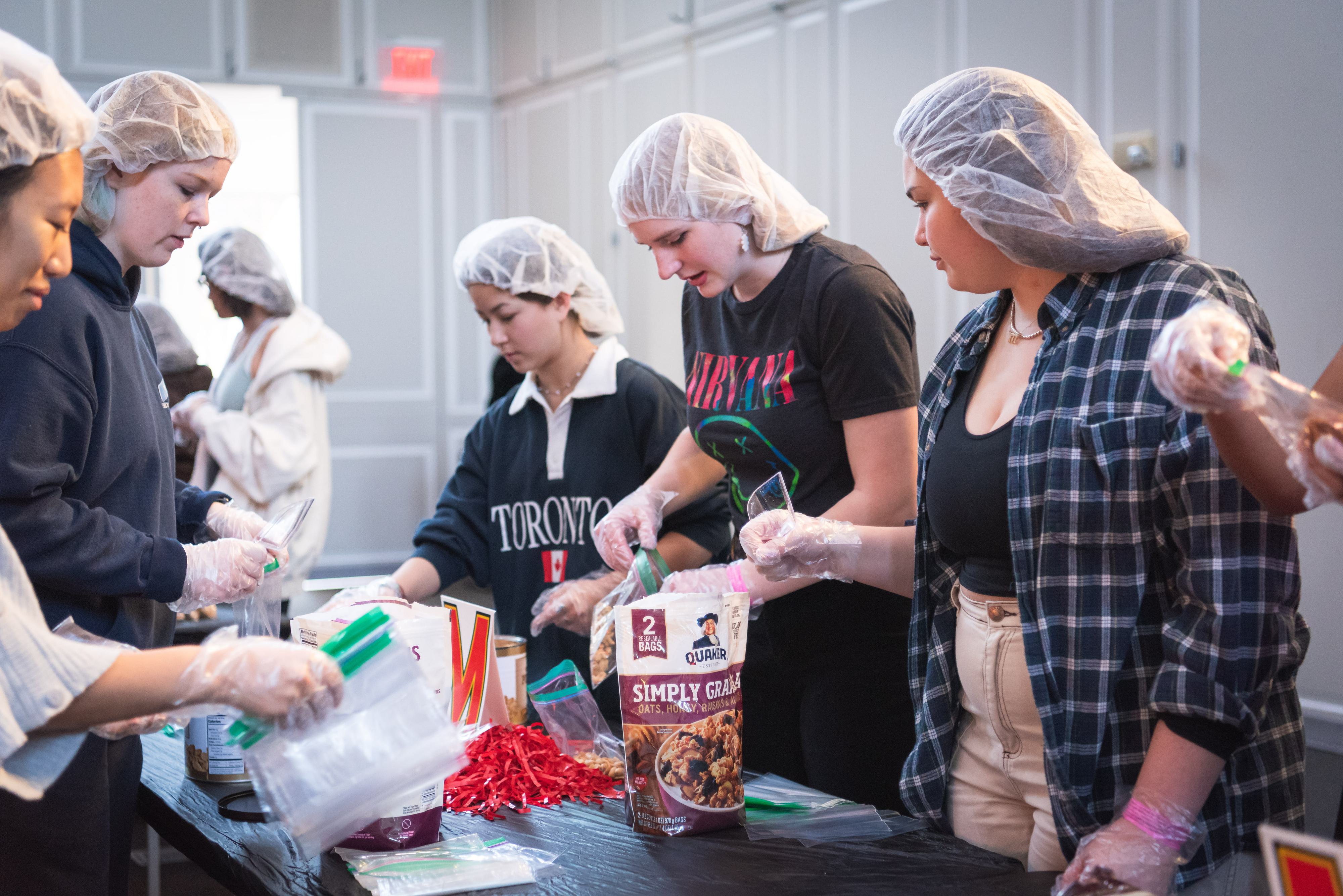 Volunteers packing food at the Martha's Table Event