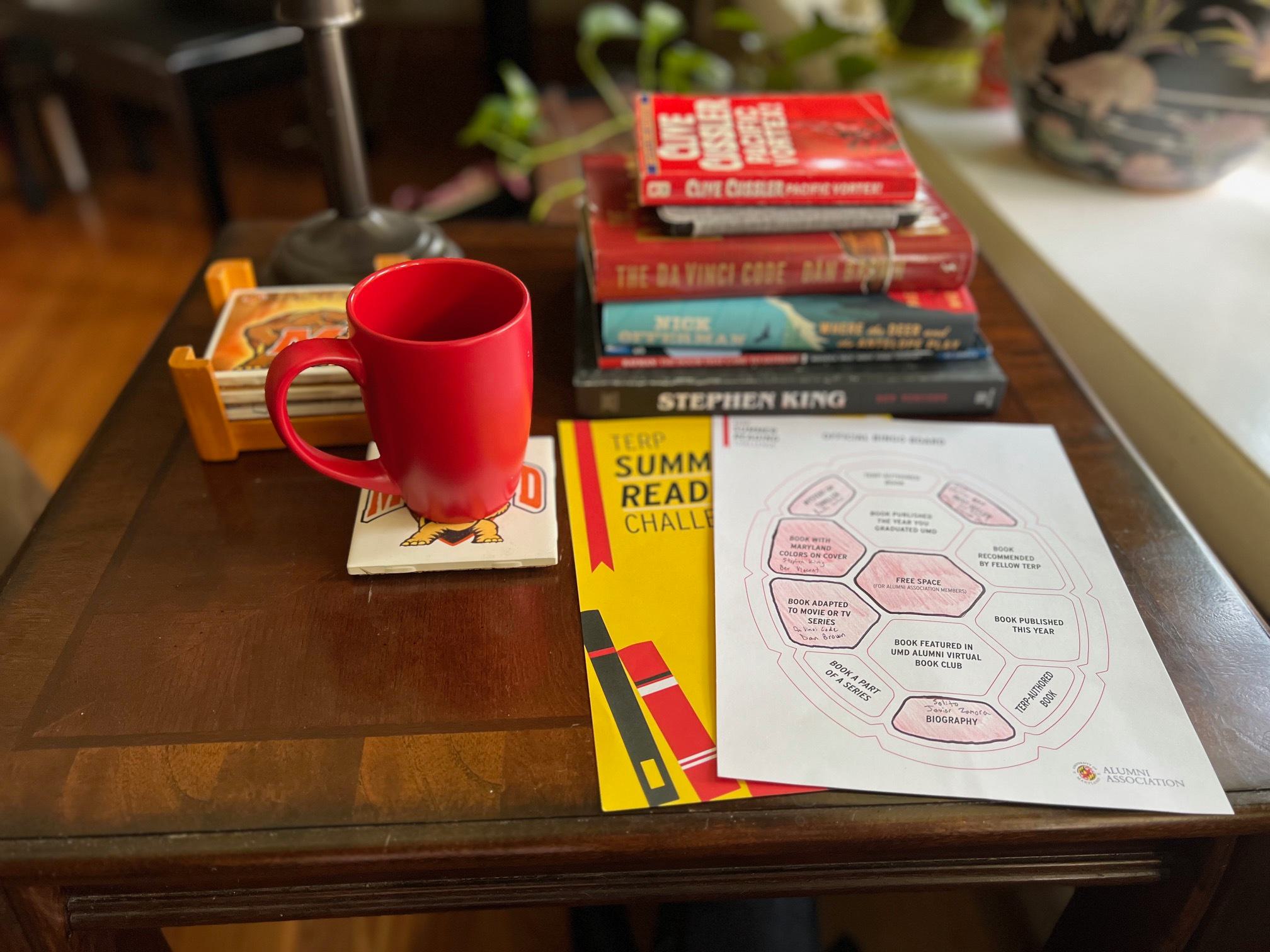 Summer Reading Challenge materials and books on a coffee table