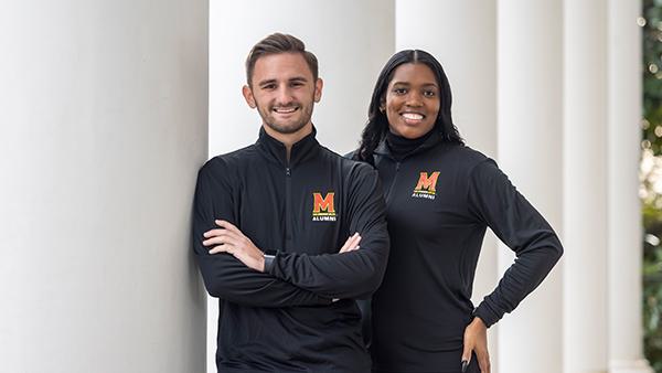 Ethan Jenkins '22 and Jelani Saltibus '15 wearing the Maryland alumni pullover.