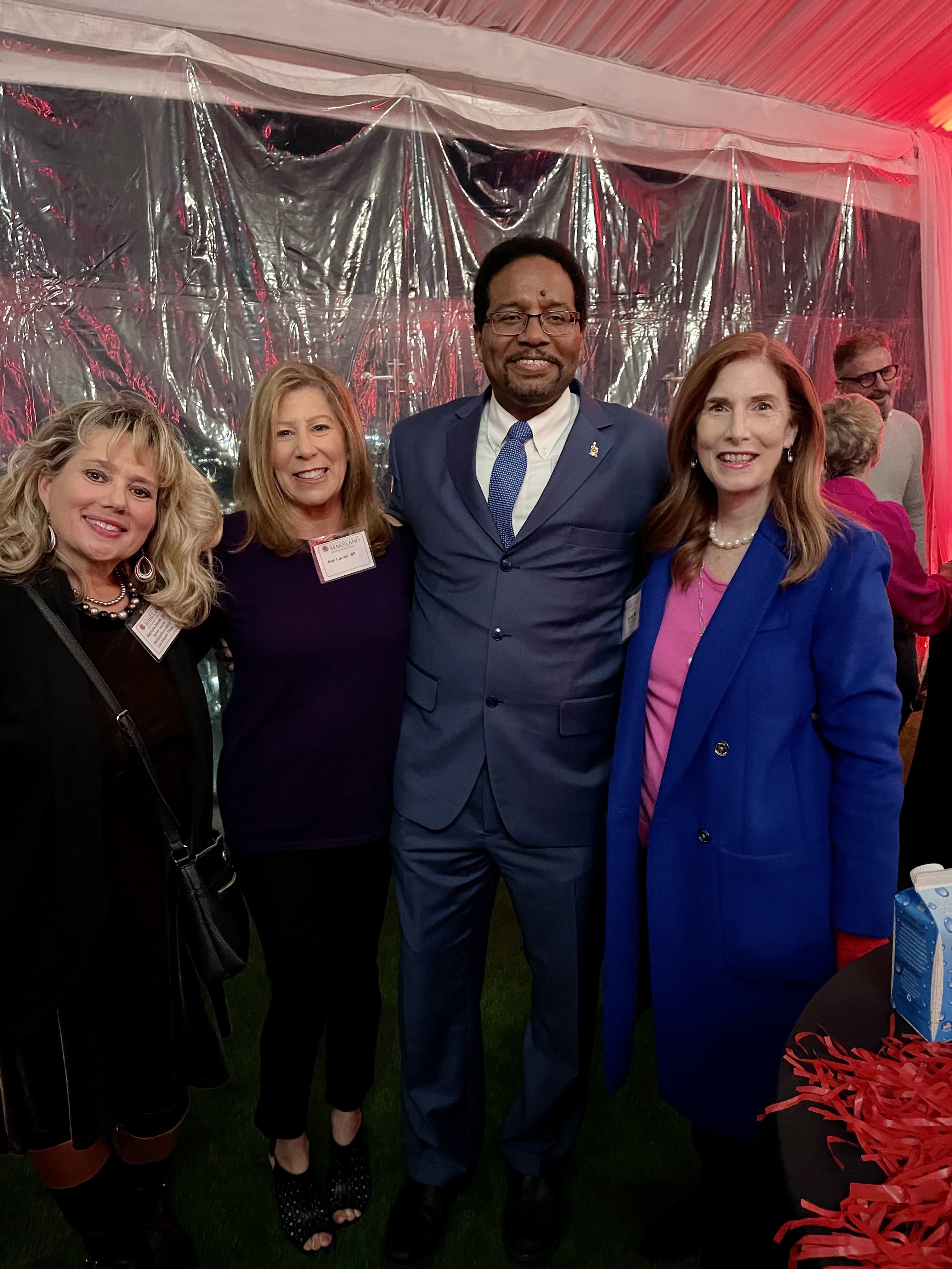 P.K Daniel at an Alumni Association event posing with UMD President Darryl J. Pines