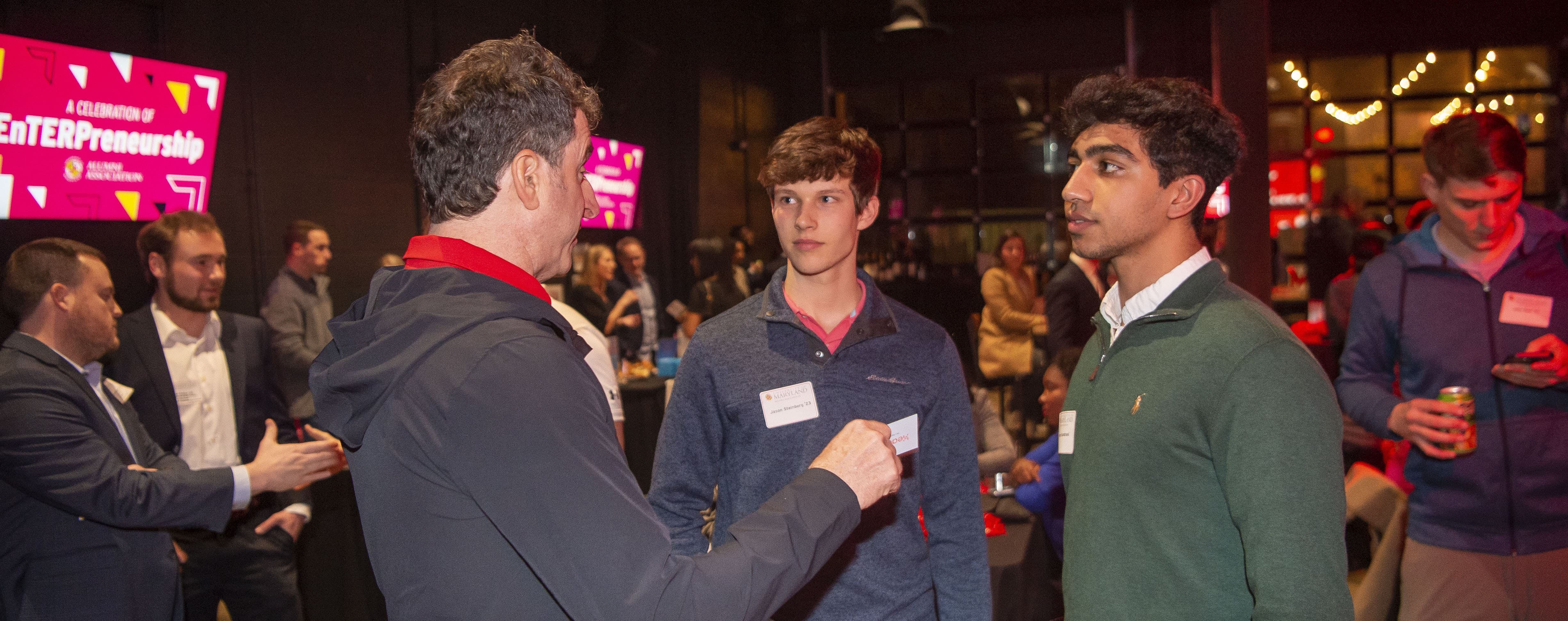 Students networking with Scott Plank