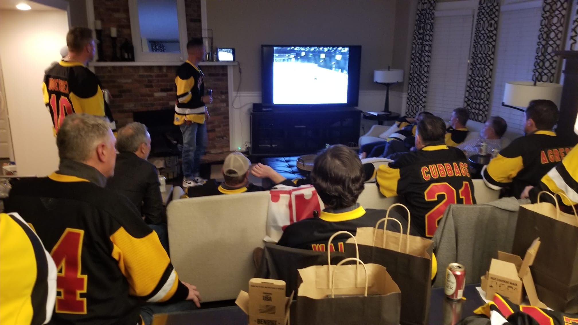 The 1991-92 UMD Club Hockey team gathered at their 30th reunion to watch a video of their historic win at the 1992 Crab Pot tournament.