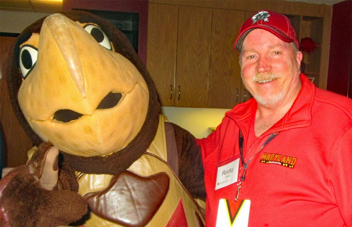 Testudo mascot and Dr. Rocky Lopes '80