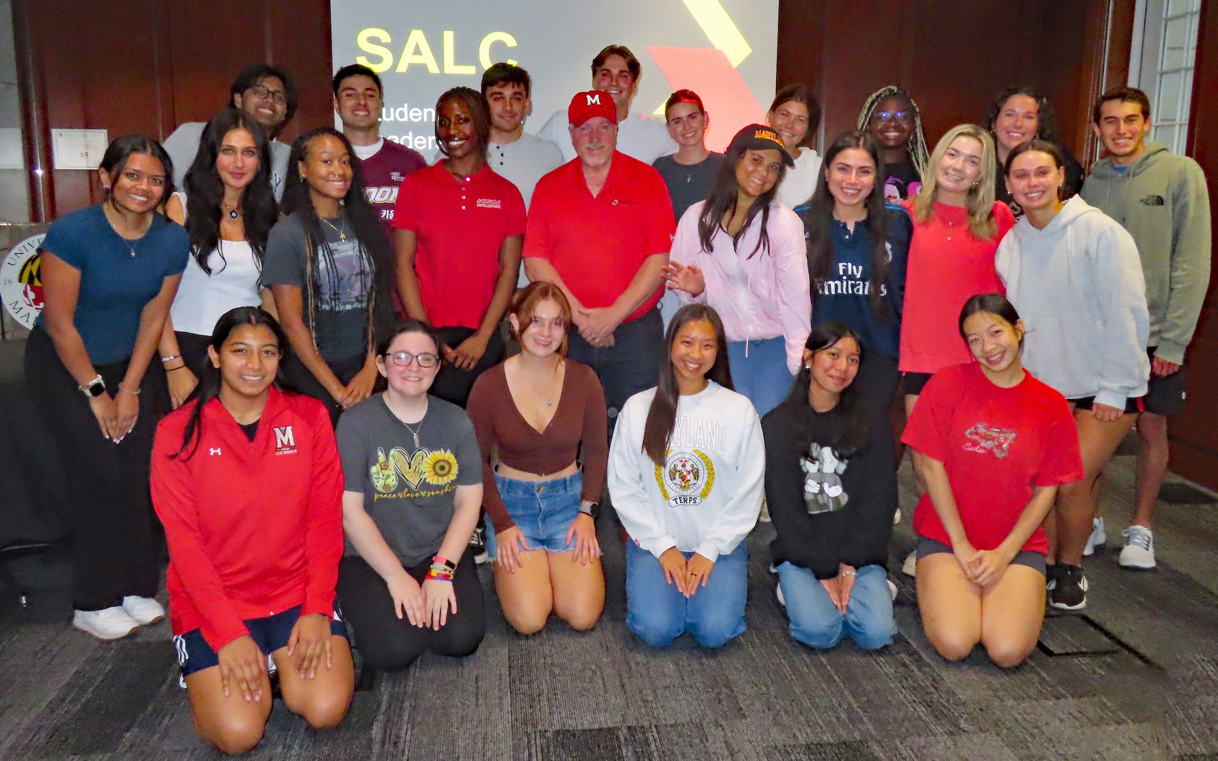Large group photo of the 2024 SALC students with Dr. Rocky Lopes '80