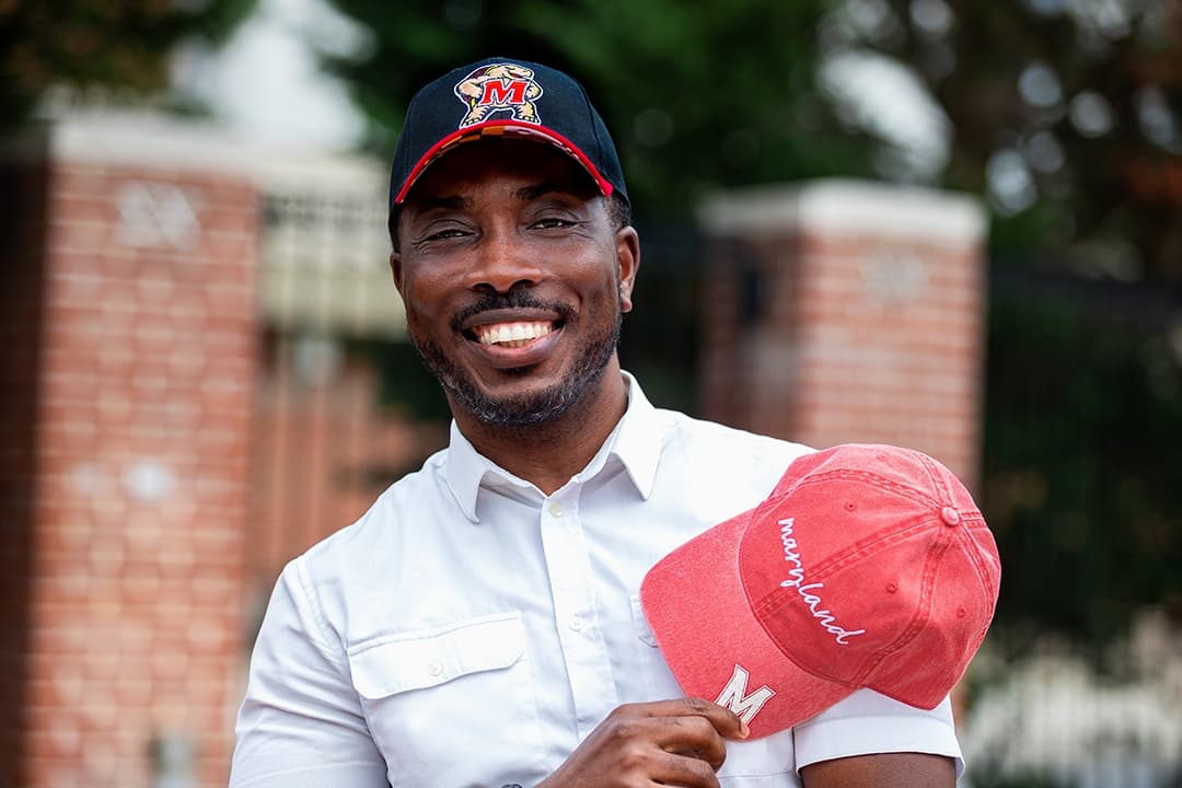 Wendell Ayivie with Maryland hats.