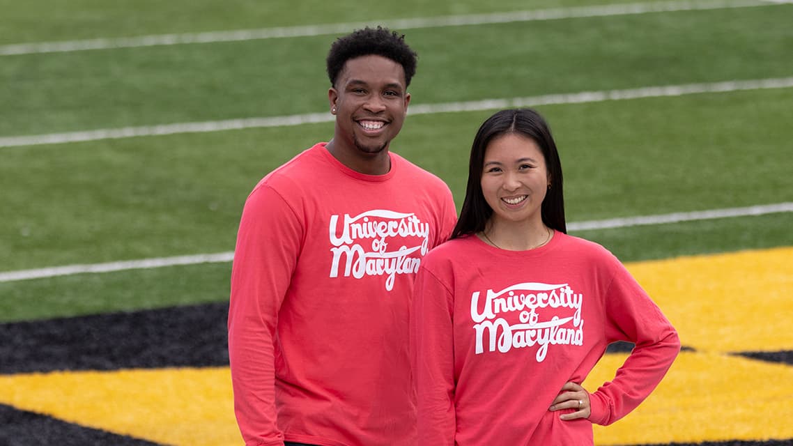 Will Hunter III M.A. '20 and Rose Ligsay wearing the fall 2023 long-sleeve shirt