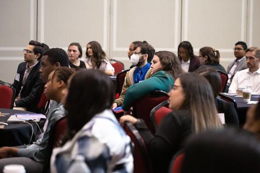 Attendees listen to the keynote address in Orem Hall to start the day off at the inaugural Young Alumni Conference.