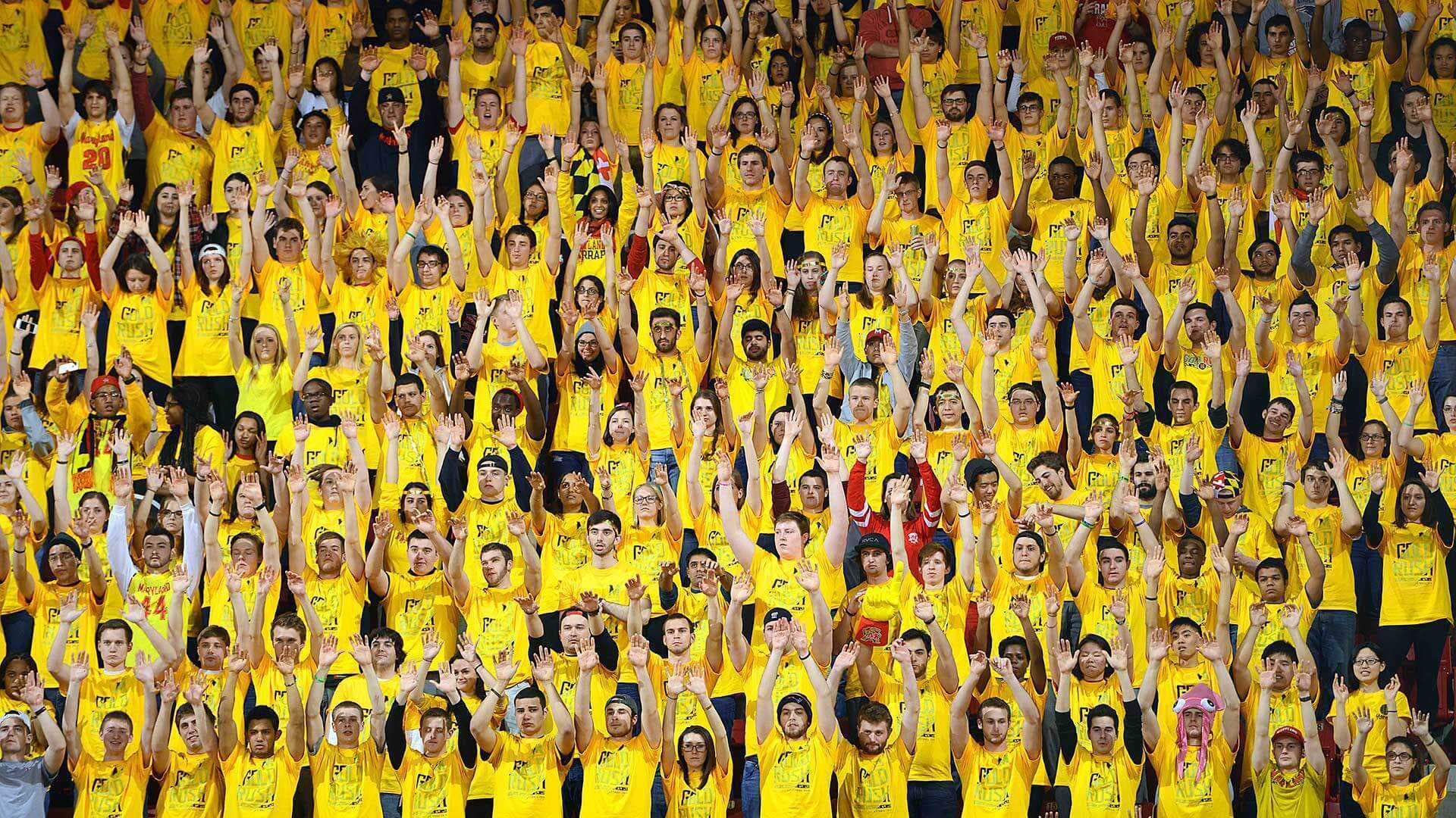 Wall of students celebrating the basketball game