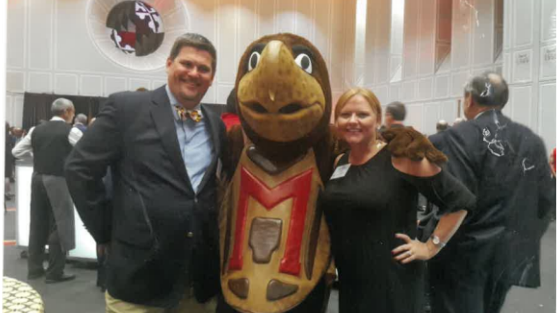 Chad and Jessica Roberts with Testudo in the Riggs Alumni Center