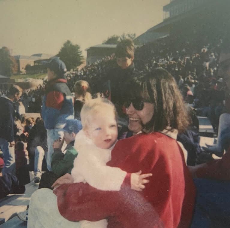 Baby Stephanie Groff '13 and her mom, Julie Groff '83 attend a football game