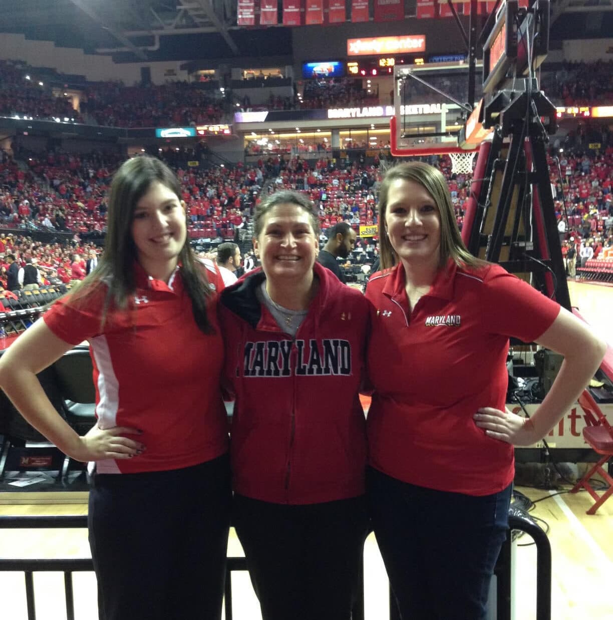Hayley Groff '16, Julie Groff '83 and Stephanie Groff '13 attend a basketball game